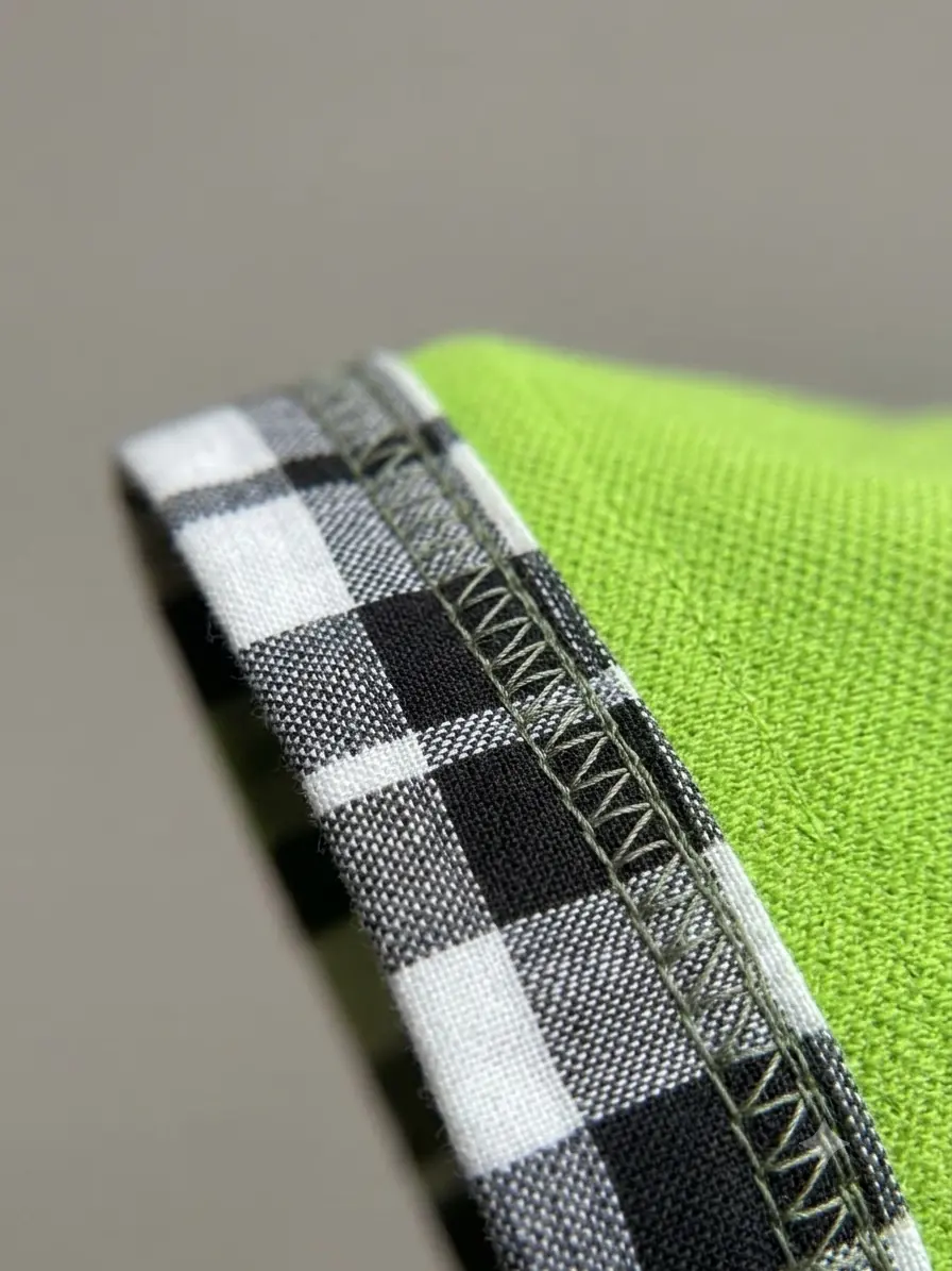 Close-up of checked sleeve cuff and stitching